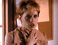 Molly Ringwald clasps her throat in anticipation of some slasher action!