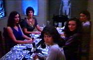 five, of the six actresses expected, sit around the table waiting for Stryker's appearance...