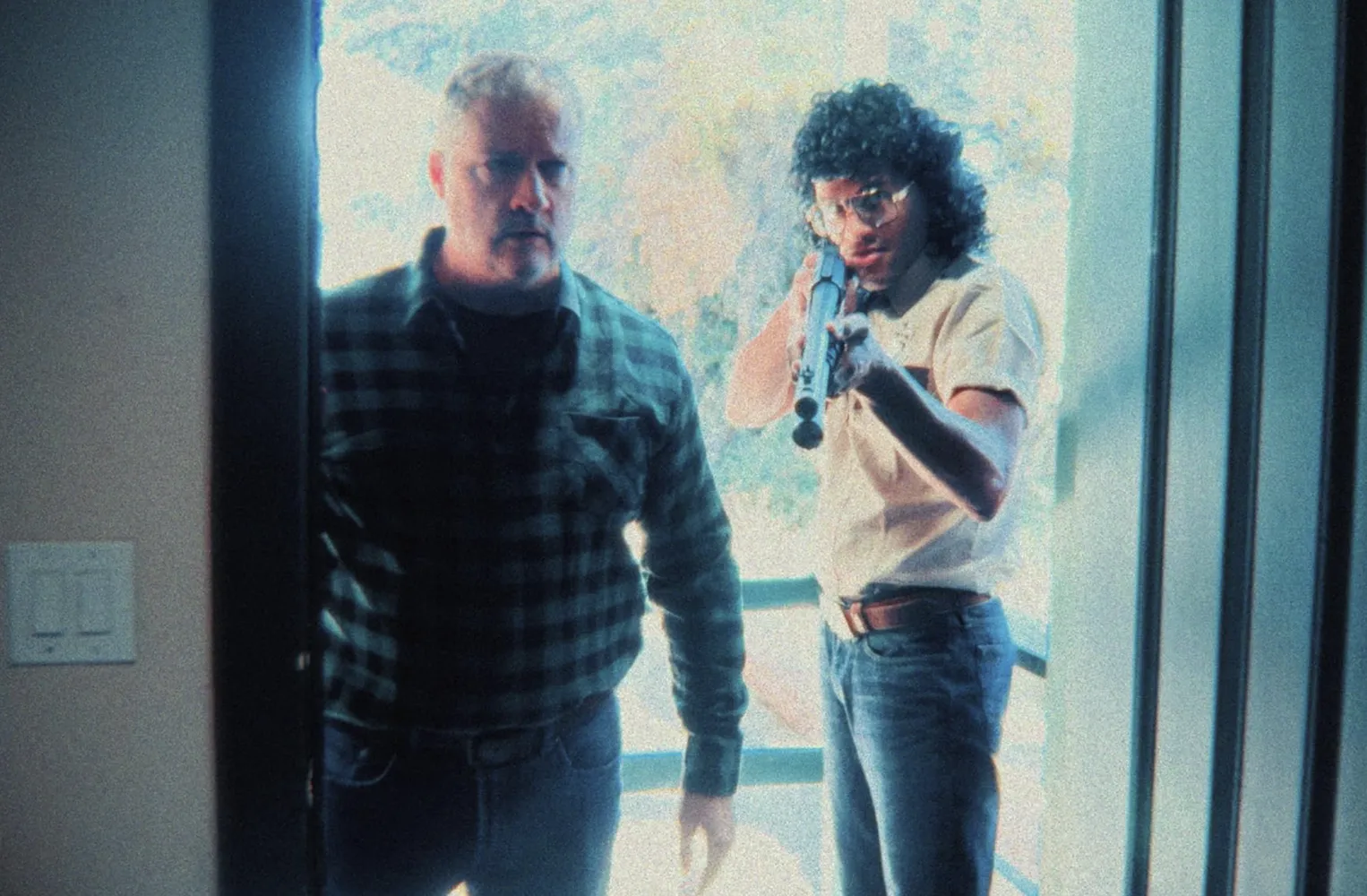 Gus (Chris Offerman) and Henry (Austen Jaye), as the campground's smooth security guard with a wet look perm.
