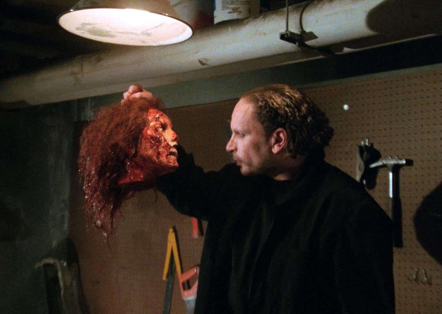 Gordon (Gérard Zalcberg) takes his job as creepy janitor very seriously in FACELESS