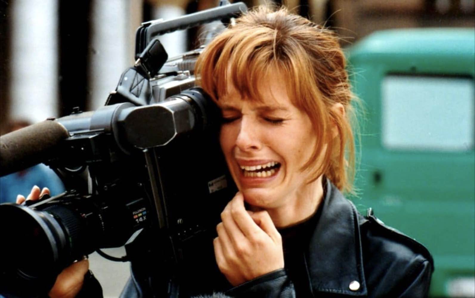 You would cry too if you had to carry a camer this size for the duration of the movie. Lucia (Natasha Hovey)