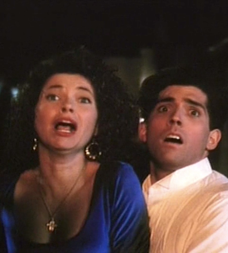 Nikki de Boer and Alden Kane battle the psycho priest in PROM NIGHT IV: DELIVER US FROM EVIL (1991)