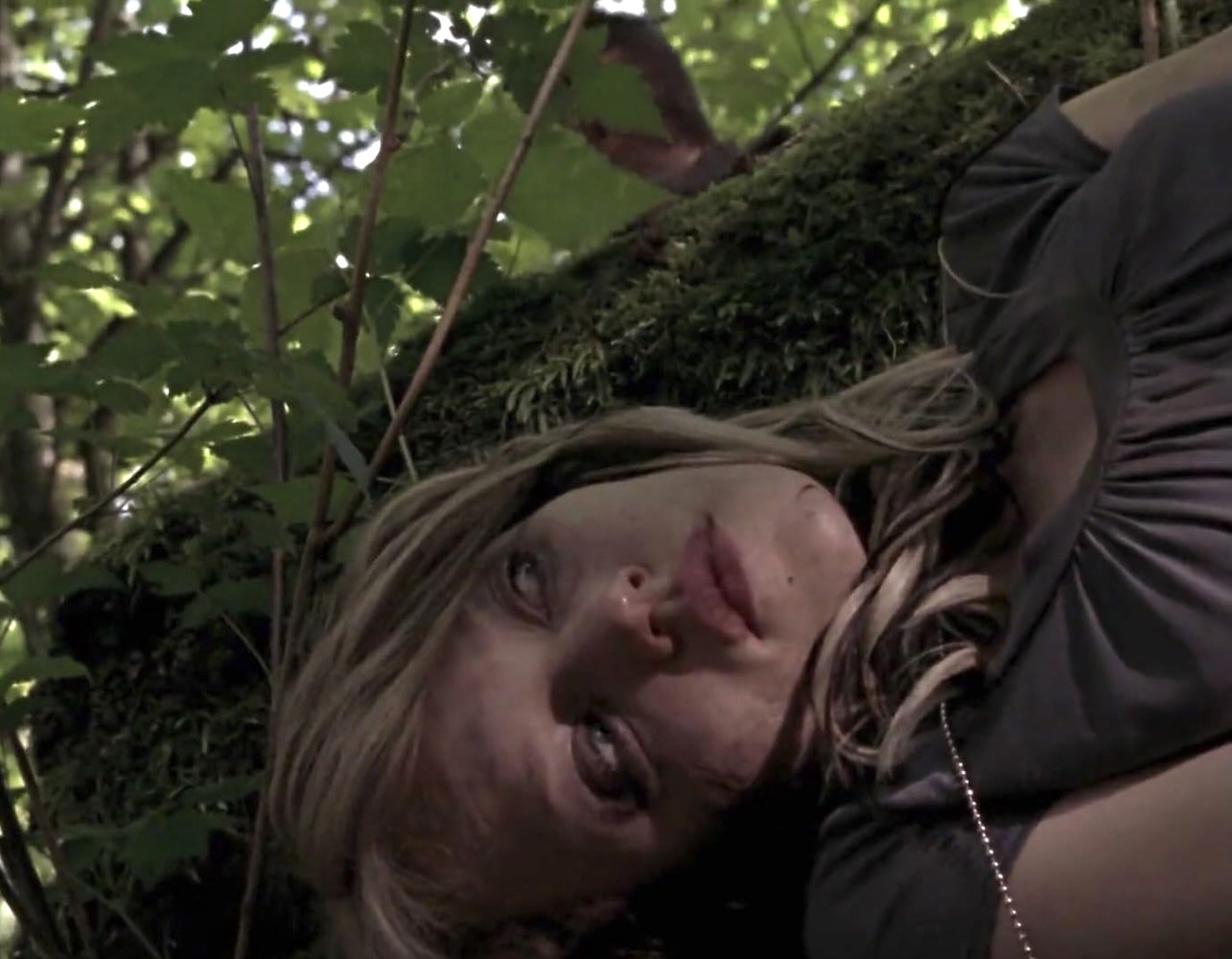 Nina (Erica Leerhsen) hides from the hungry killers in slasher sequel WRONG TURN 2